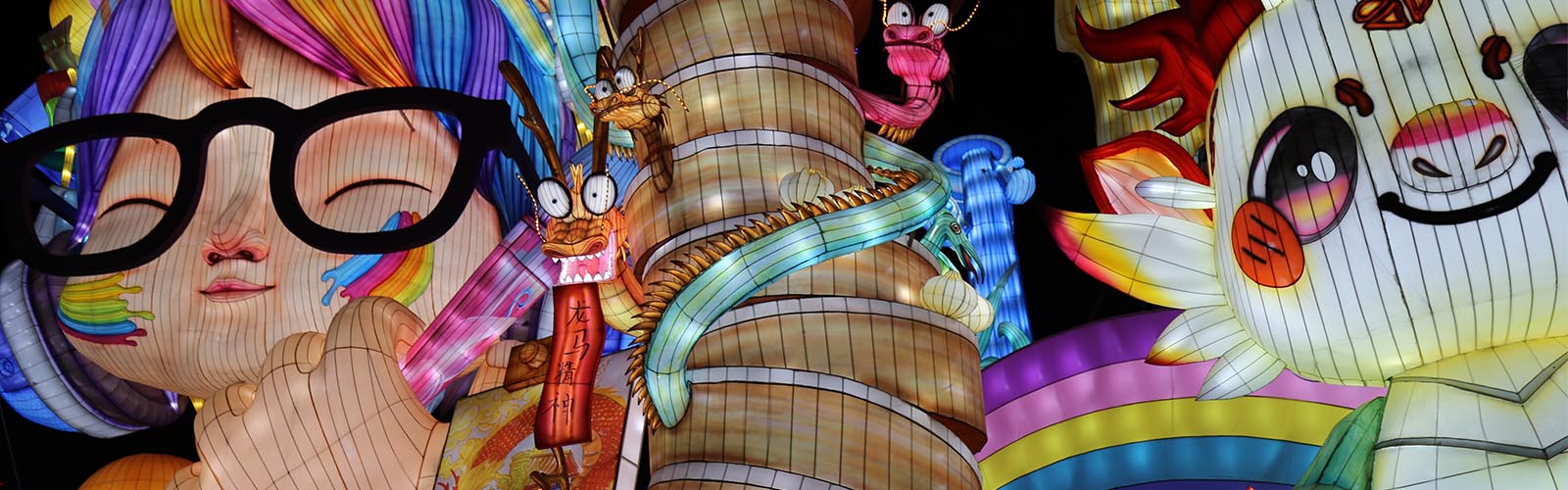 Zoo lights planning timeline — life-size illuminated animal lanterns ready for a trail
