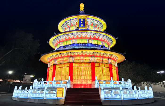 Magnificent illuminated Temple of Heaven (祈年殿) lantern replica at Montréal Botanical Garden. Authentic Chinese imperial architecture with tiered golden roofs, elaborate red columns and detailed color paintings. Architectural centerpiece showcasing classical Chinese design to Canadian audiences.