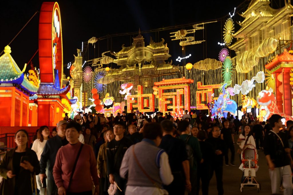 Zigong lantern festival panorama at night with illuminated dragon and traditional Chinese lanterns