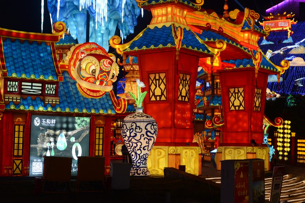 Traditional red Chinese lantern display with multi-color decorative elements showcasing red as the dominant lucky color in Chinese festival culture