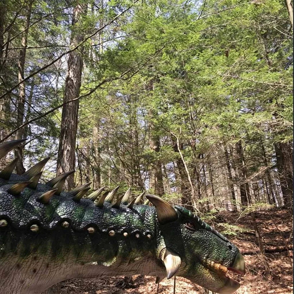 Animatronic Ankylosaurus side profile showing armoured body and tail club detail