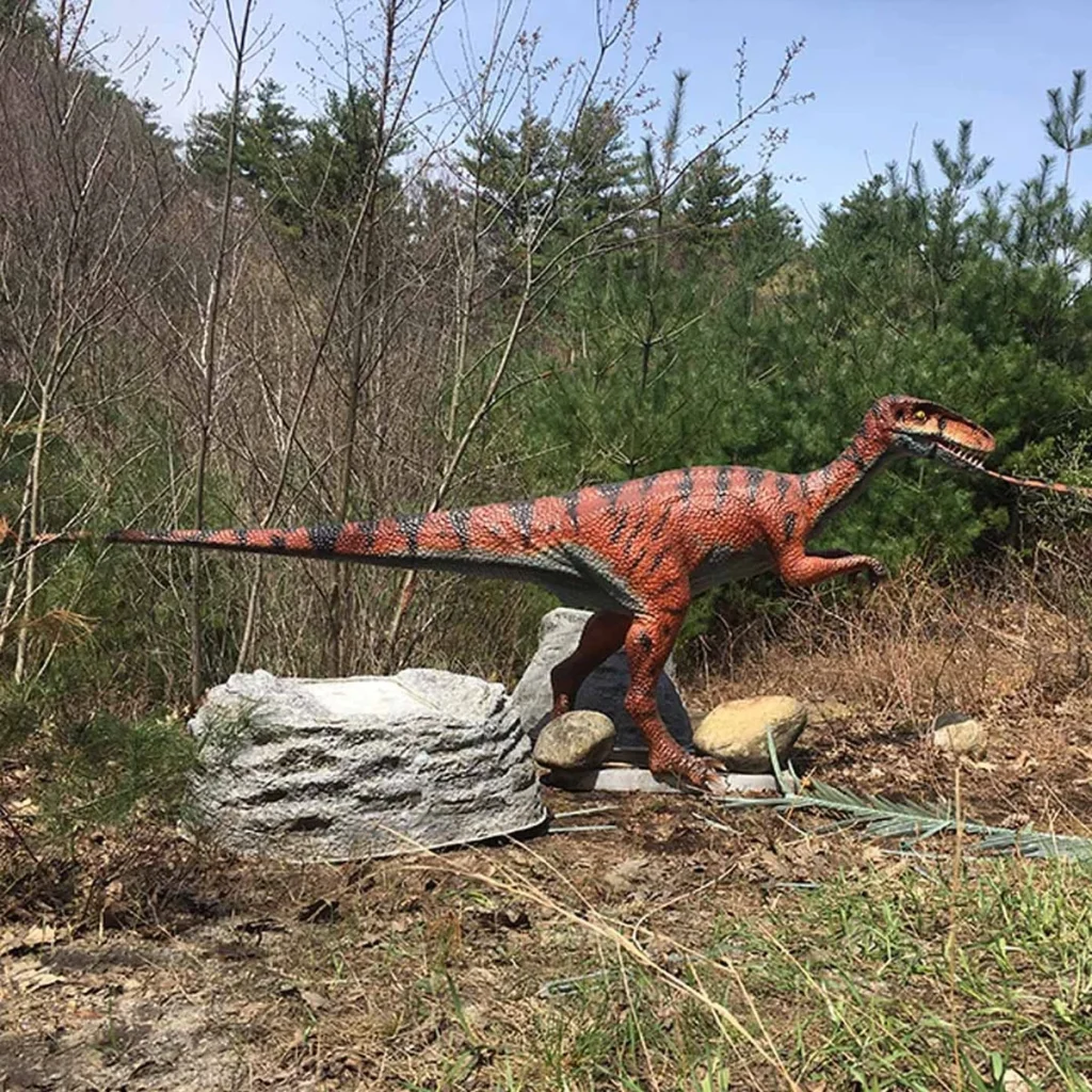 Animatronic Coelophysis profile side view showing slender body and tail structure