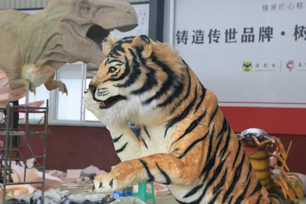 Life-size animatronic tiger model with realistic orange and black striped silicone skin standing pose