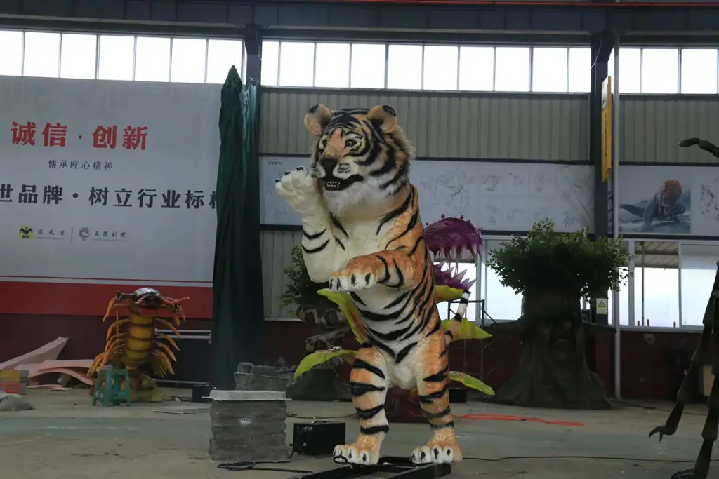 Close-up of animatronic tiger head with amber eyes and detailed facial features