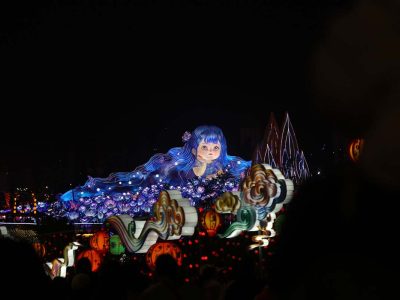 Illuminated Girl in Flowers Festival Centrepiece