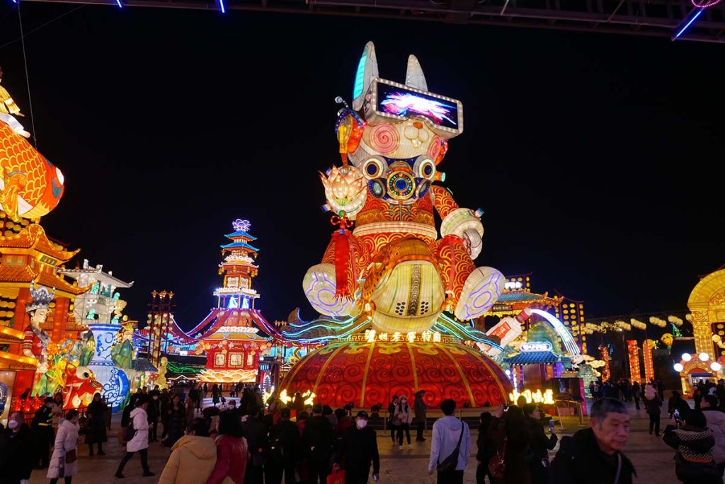 Multi-tier Mid-Autumn Festival moon palace tower lantern with Chang'e goddess, jade rabbit and palace architecture at night