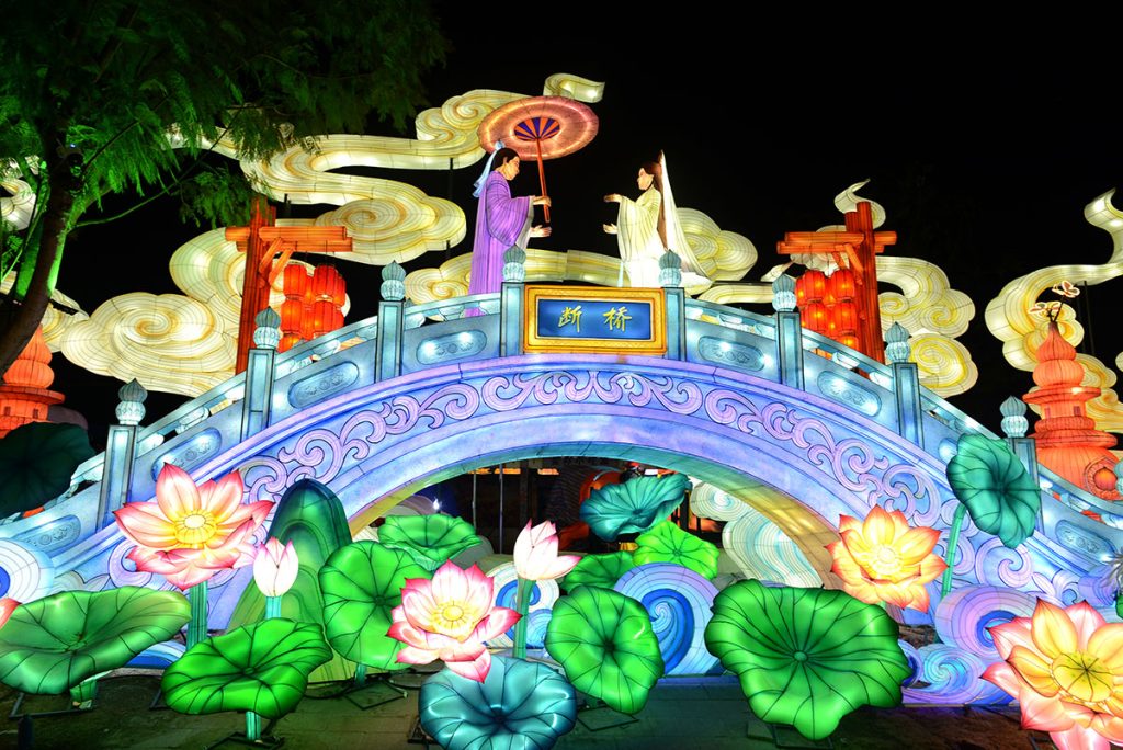 Mid-autumn festival lotus lantern bridge with waterfall scene at night