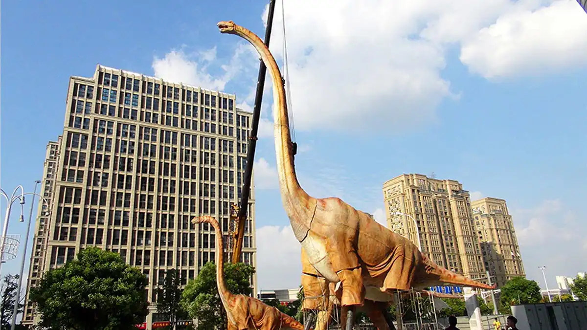 Adult and juvenile animatronic brachiosaurus family display outside a Nanjing shopping mall