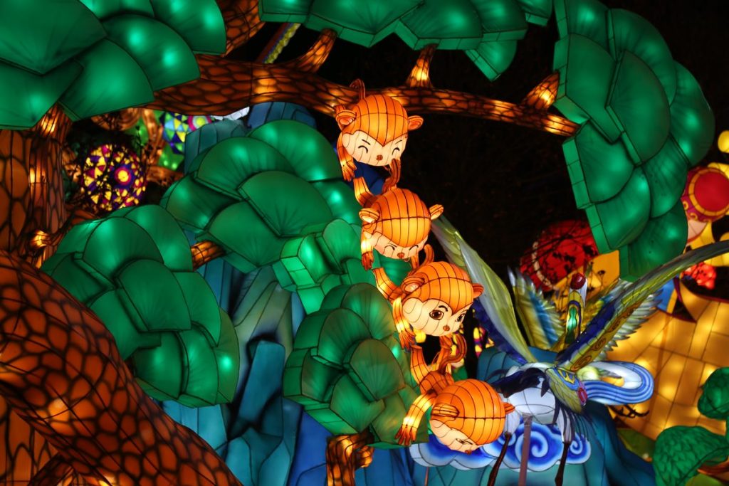 Fairy forest lantern arch with an enchanted woodland scene and glowing tree canopy at night