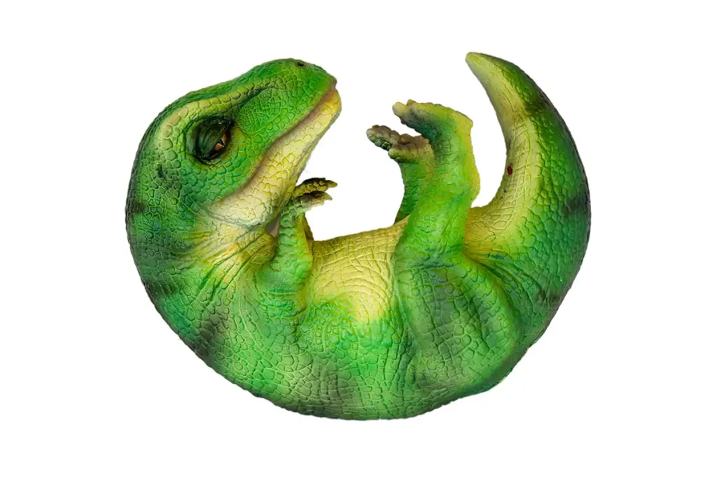 Cuddly interactive baby dinosaur puppet in curled hatchling pose with sensor module