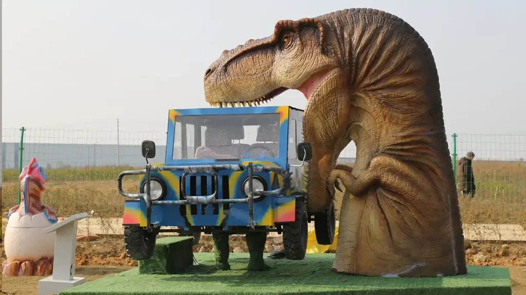 Interactive T-Rex Bites Car front view showing the animatronic T-Rex head over the jeep cockpit and a small hatching dinosaur prop beside it