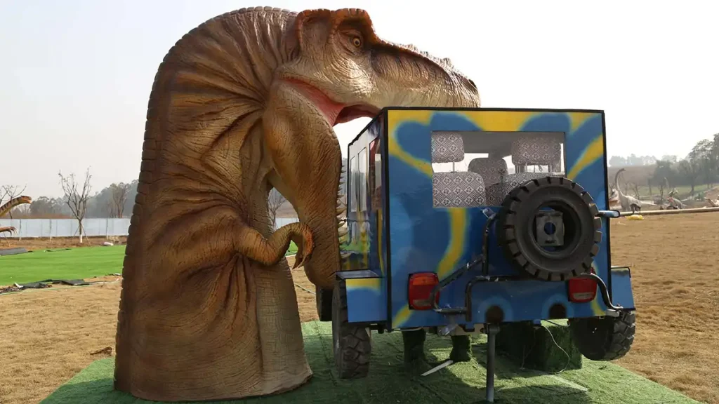 Interactive T-Rex Bites Car rear view — jeep cockpit and T-Rex head installed in a theme park venue