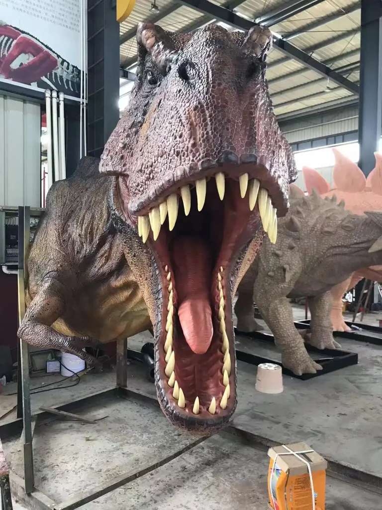 Motion-activated T-Rex gesture interactive animatronic dinosaur with open mouth and roaring pose in workshop