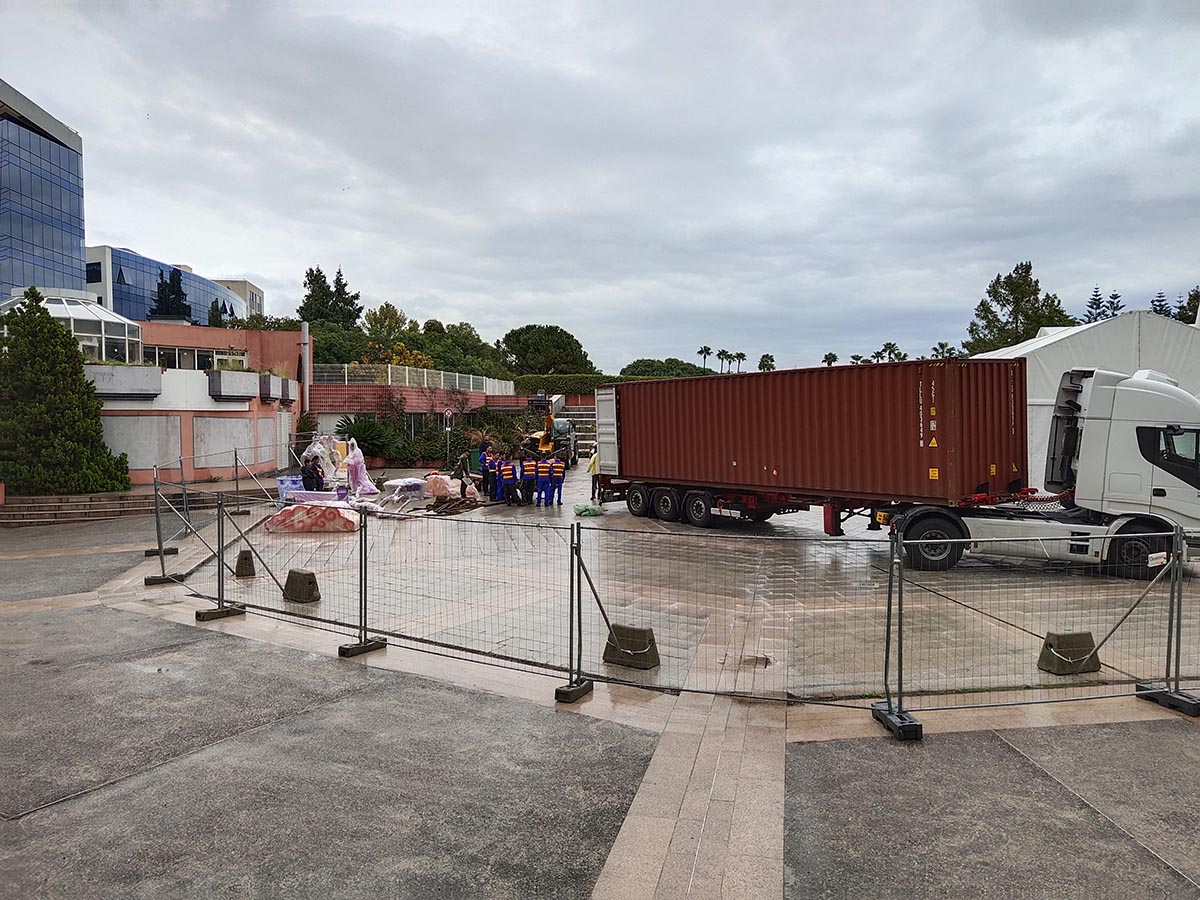 Truck delivering 40ft container of festival lanterns to European venue plaza — last-mile delivery after sea freight and customs clearance