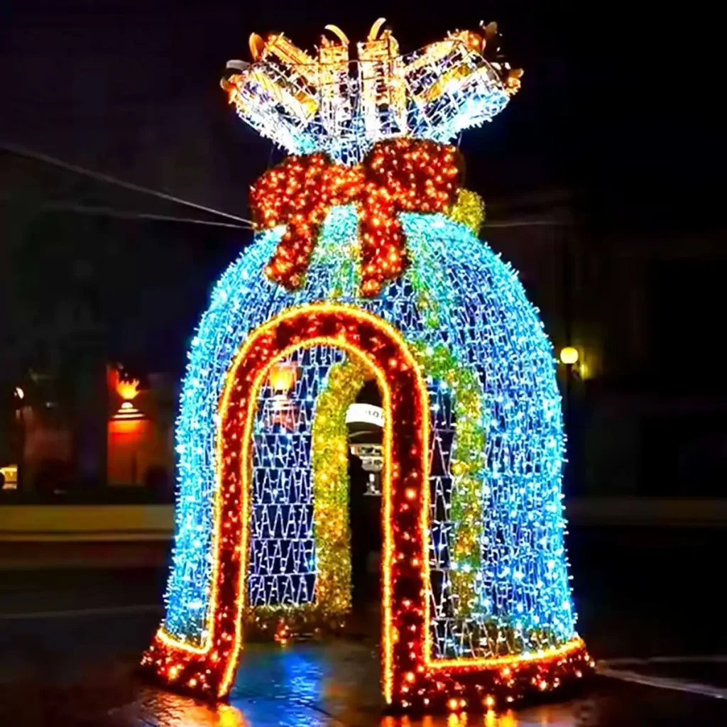 Blue illuminated reindeer light sculpture Christmas archway with two leaping reindeer and twinkling LED antlers at night