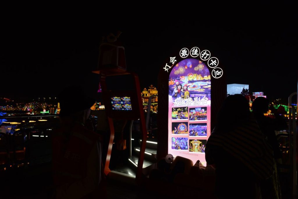 Lantern festival photo spot with illuminated arch and digital screens for visitor selfies