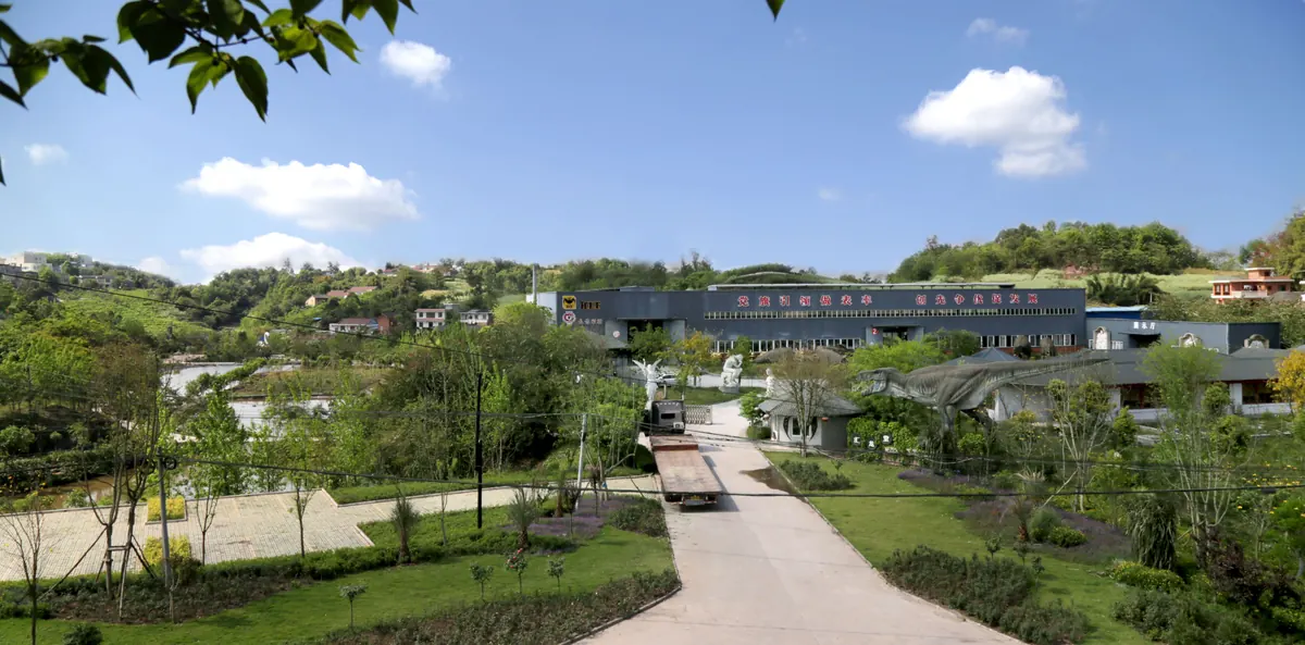 Zigong production base of FestiveLanterns, the factory campus with workshop buildings and display dinosaurs seen across the grounds