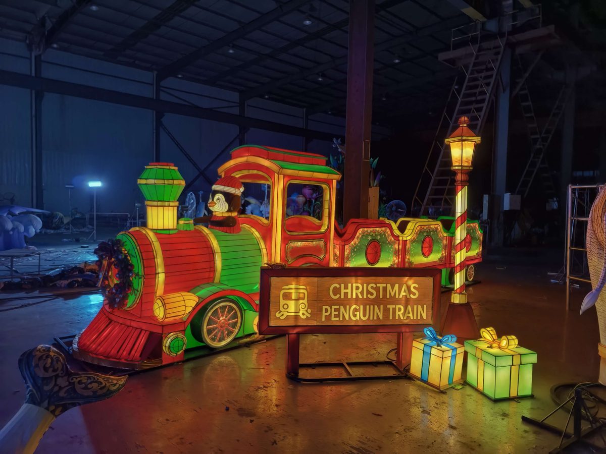 Christmas Train & Garden Arch in warm festival lighting
