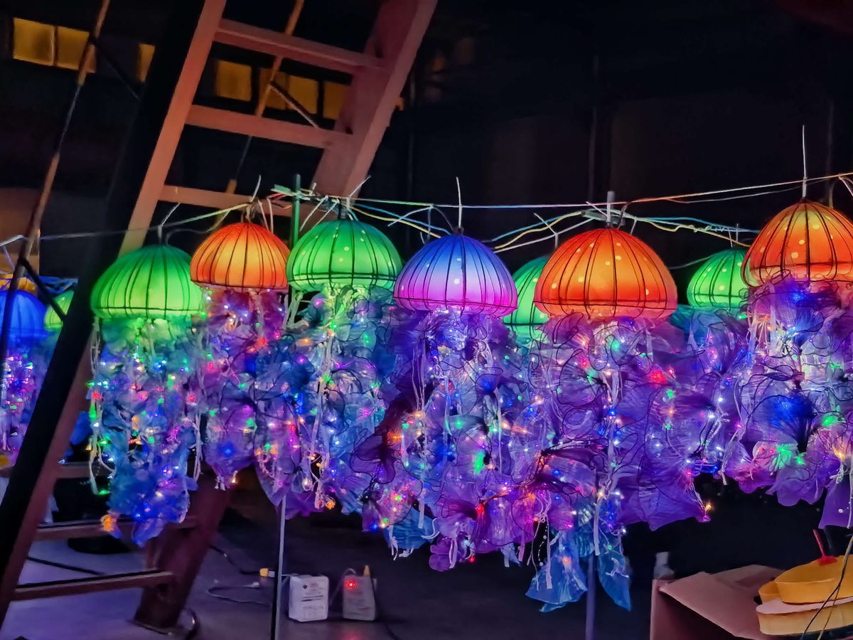 Hanging Jellyfish Lanterns in warm festival lighting