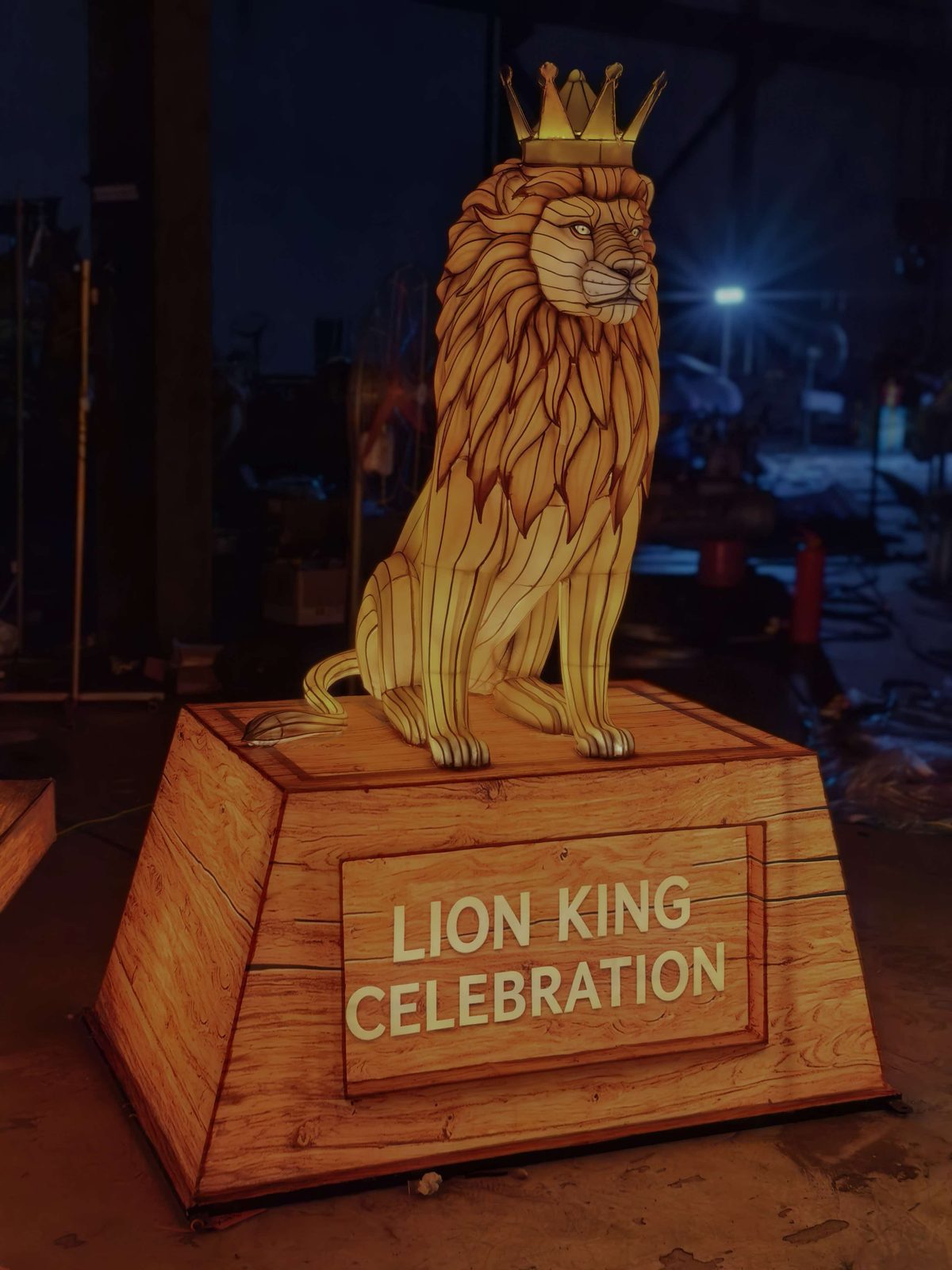 Lion Lantern on Pedestal in warm festival lighting