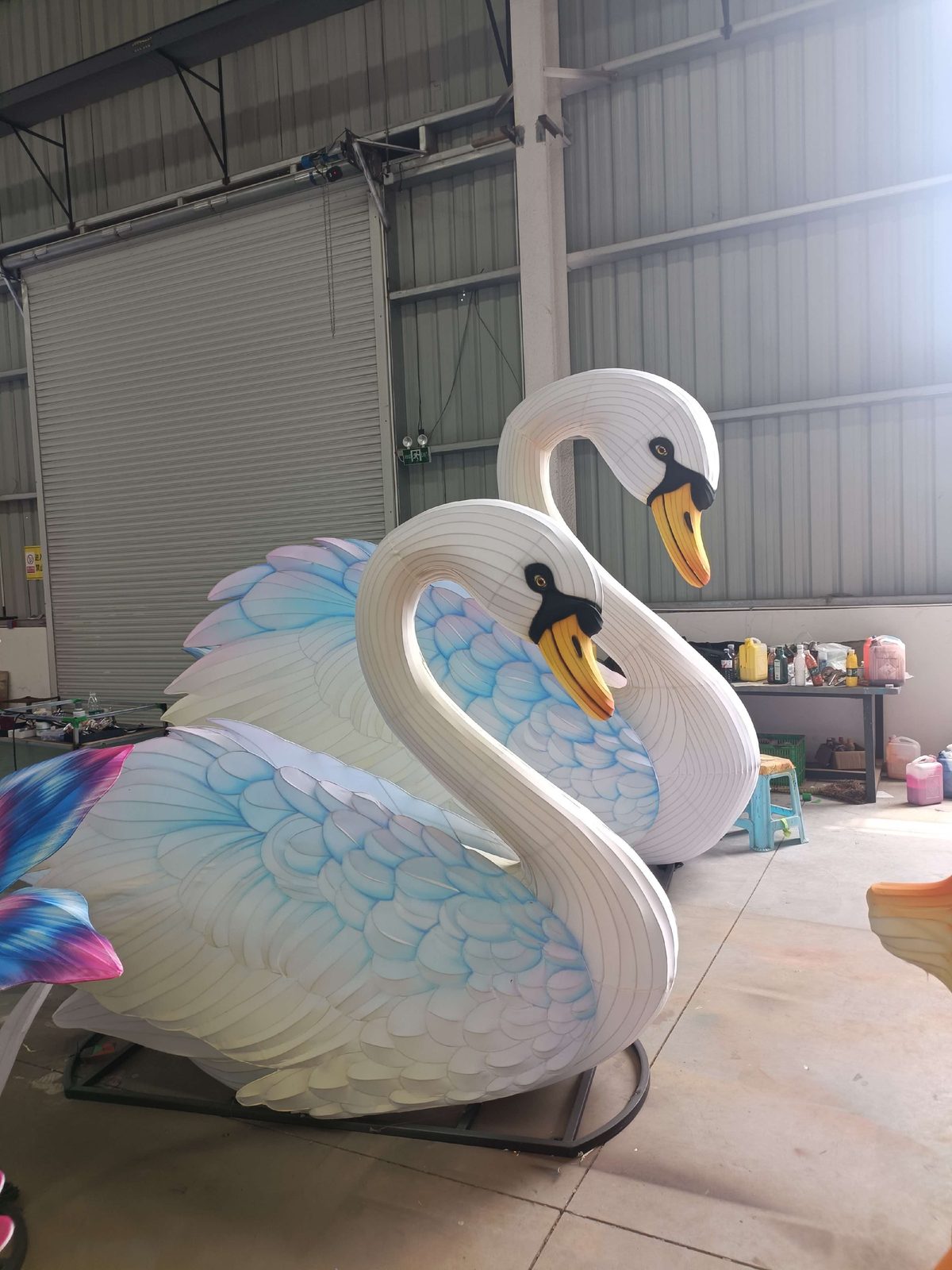 Swan Lantern Group in warm festival lighting